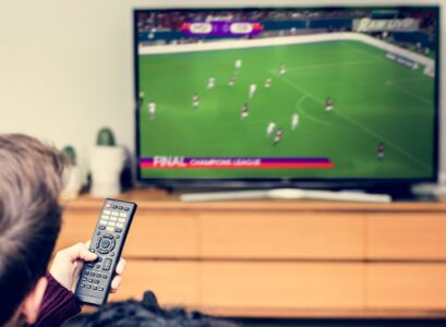 Couple watching a football game on TV