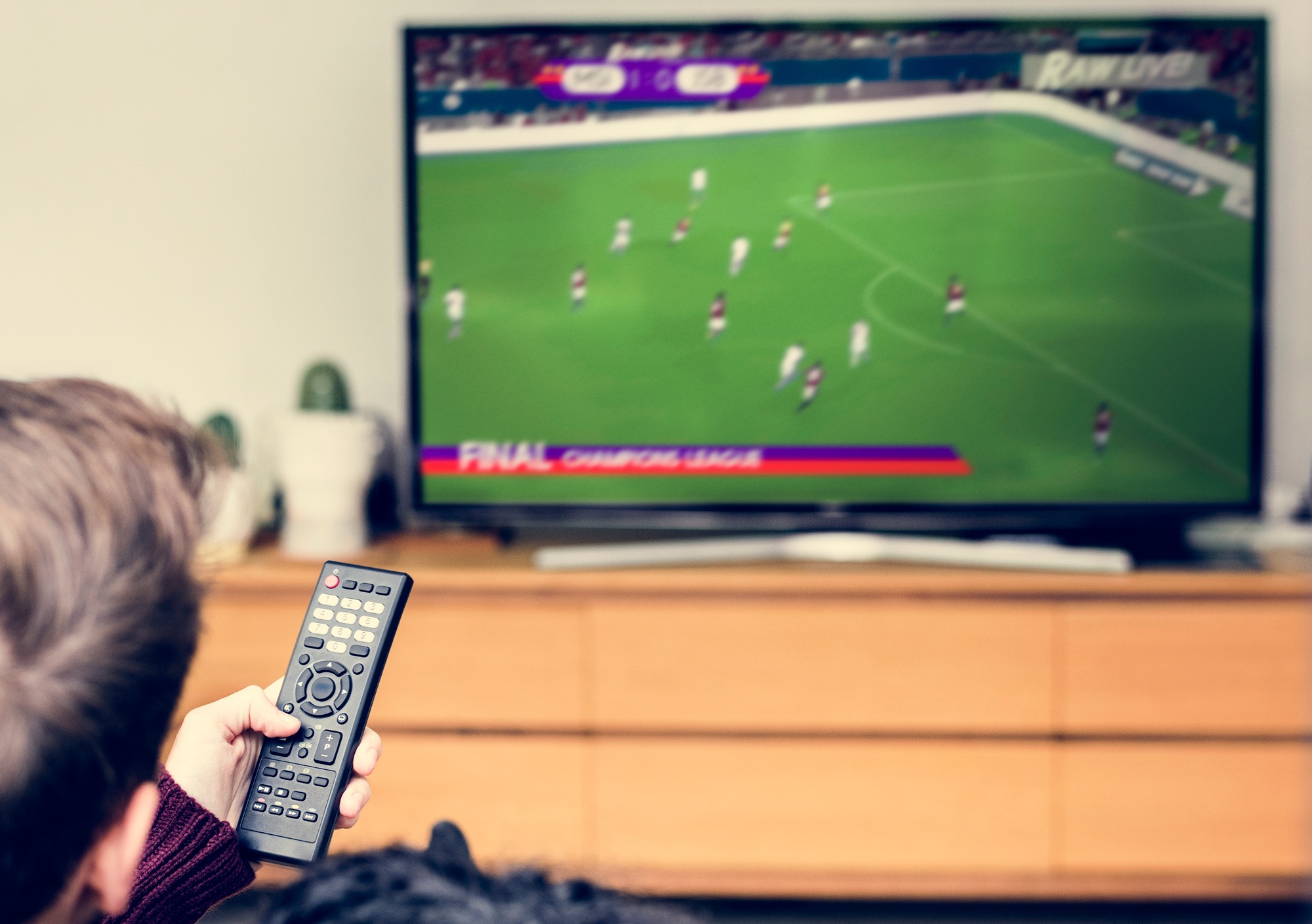 Couple watching a football game on TV