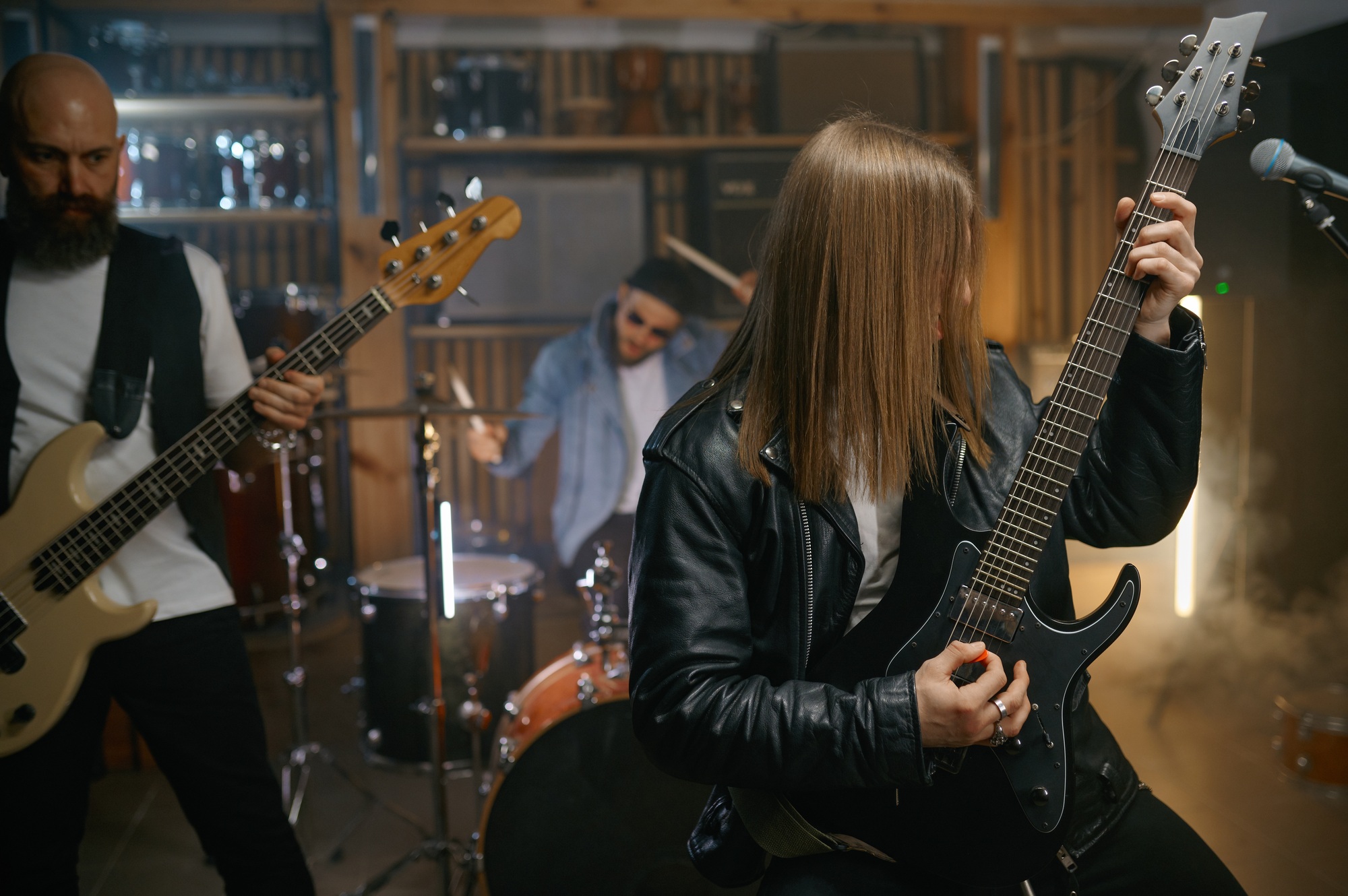 Repetition of rock music band with handsome bass guitarist playing music