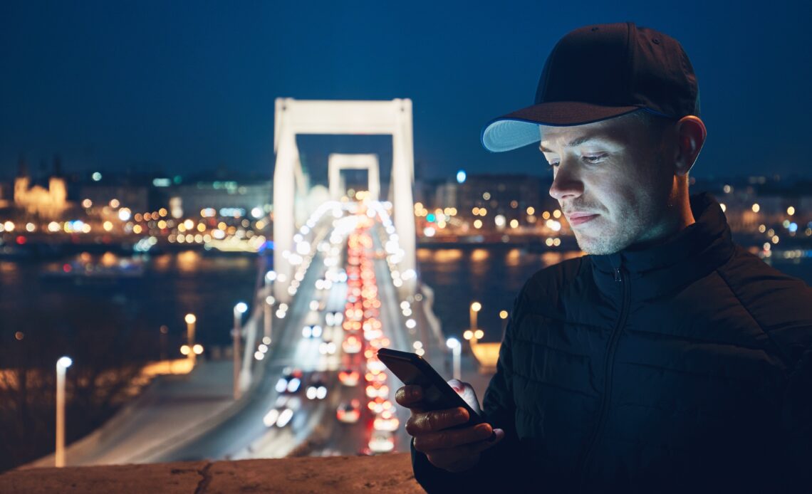 Young man reading text message